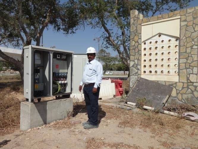 Technician at a newly installed feeder pillar
