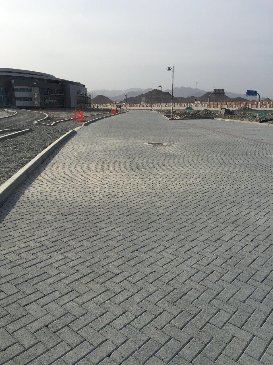 Grey interlock paving along a road