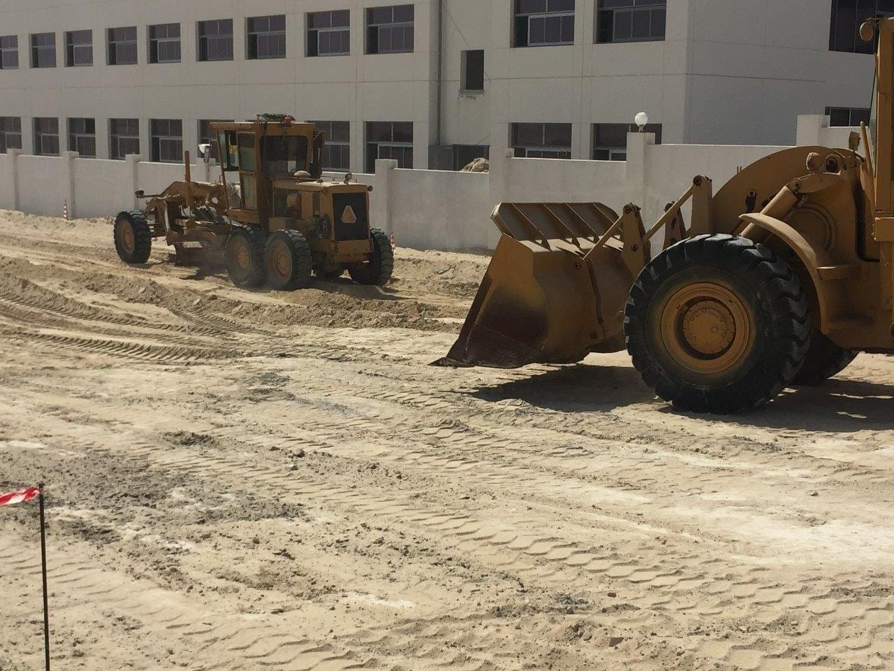 Wheel loader placing fill material
