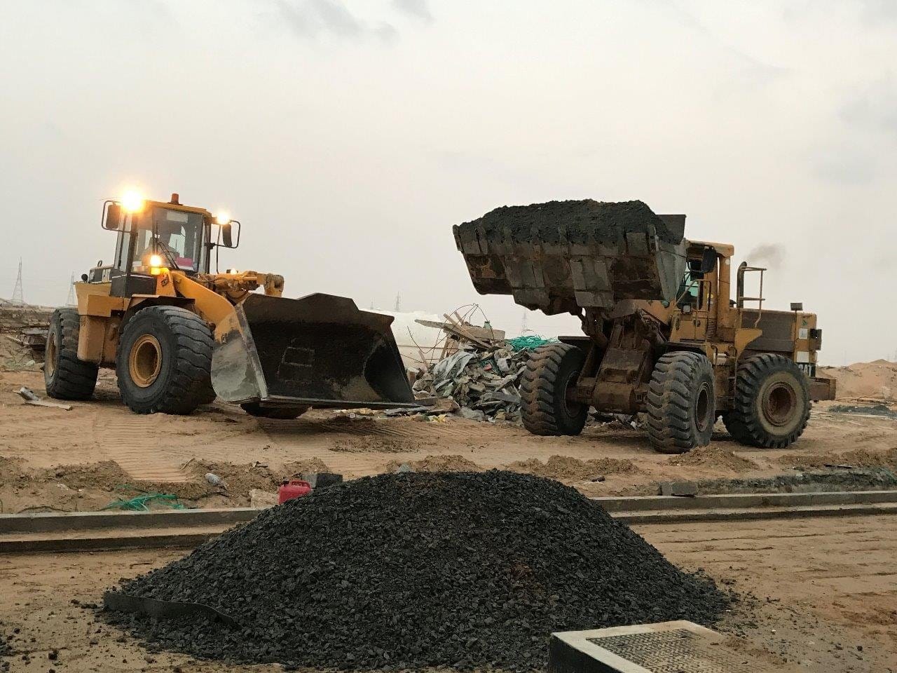 Wheel loader loading a tipper truck