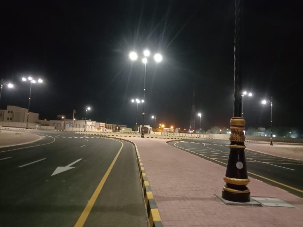 Lit junction with high-mast lighting at night