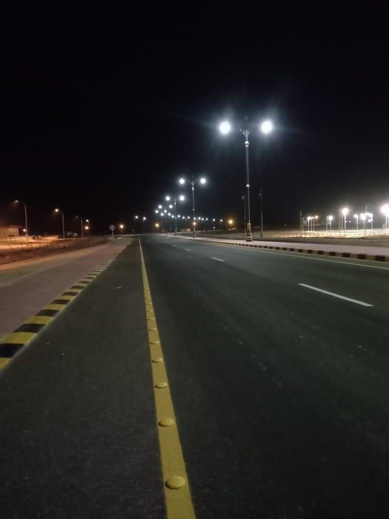 Lit avenue at night