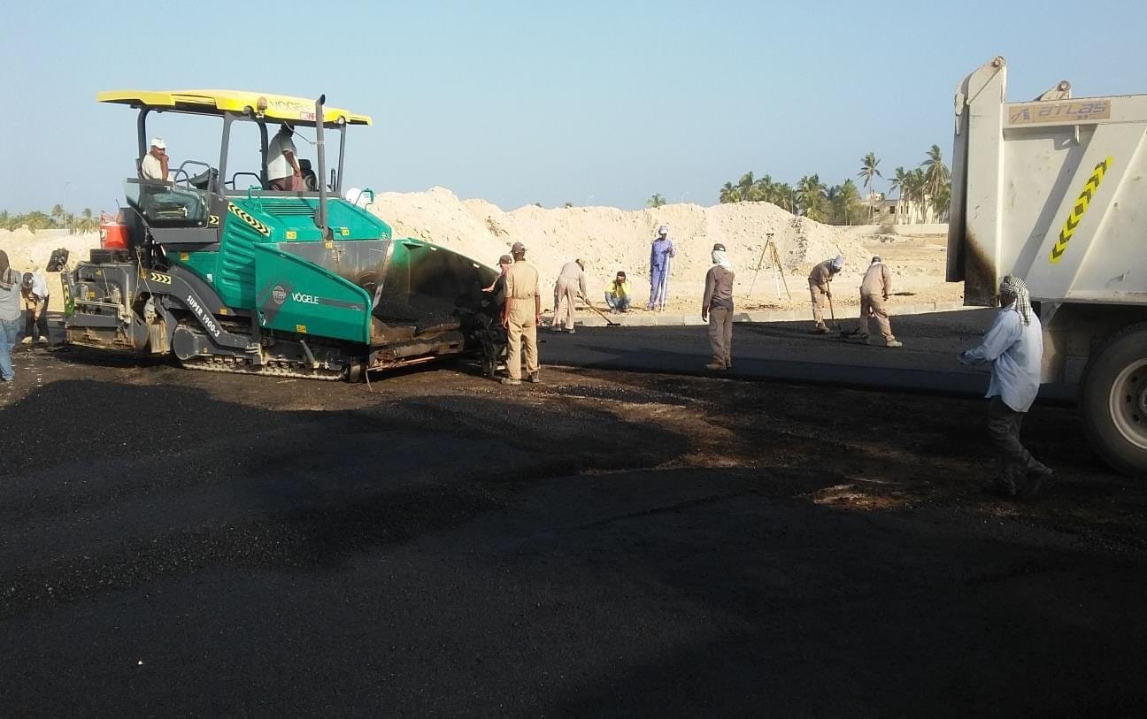 Asphalt paver laying a new surface on an internal road