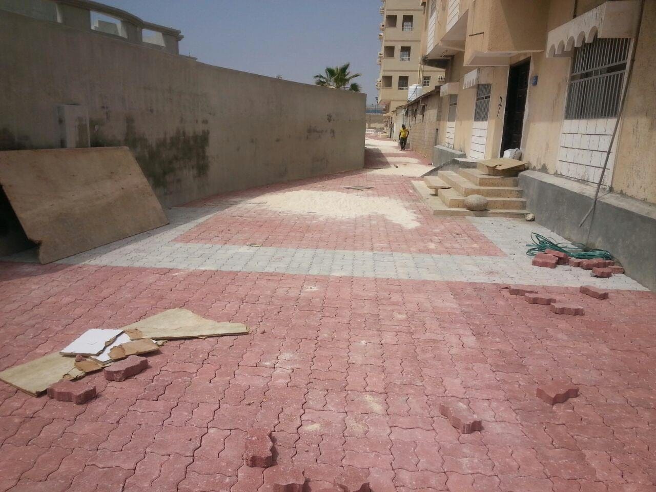 Red paving laid beside a building