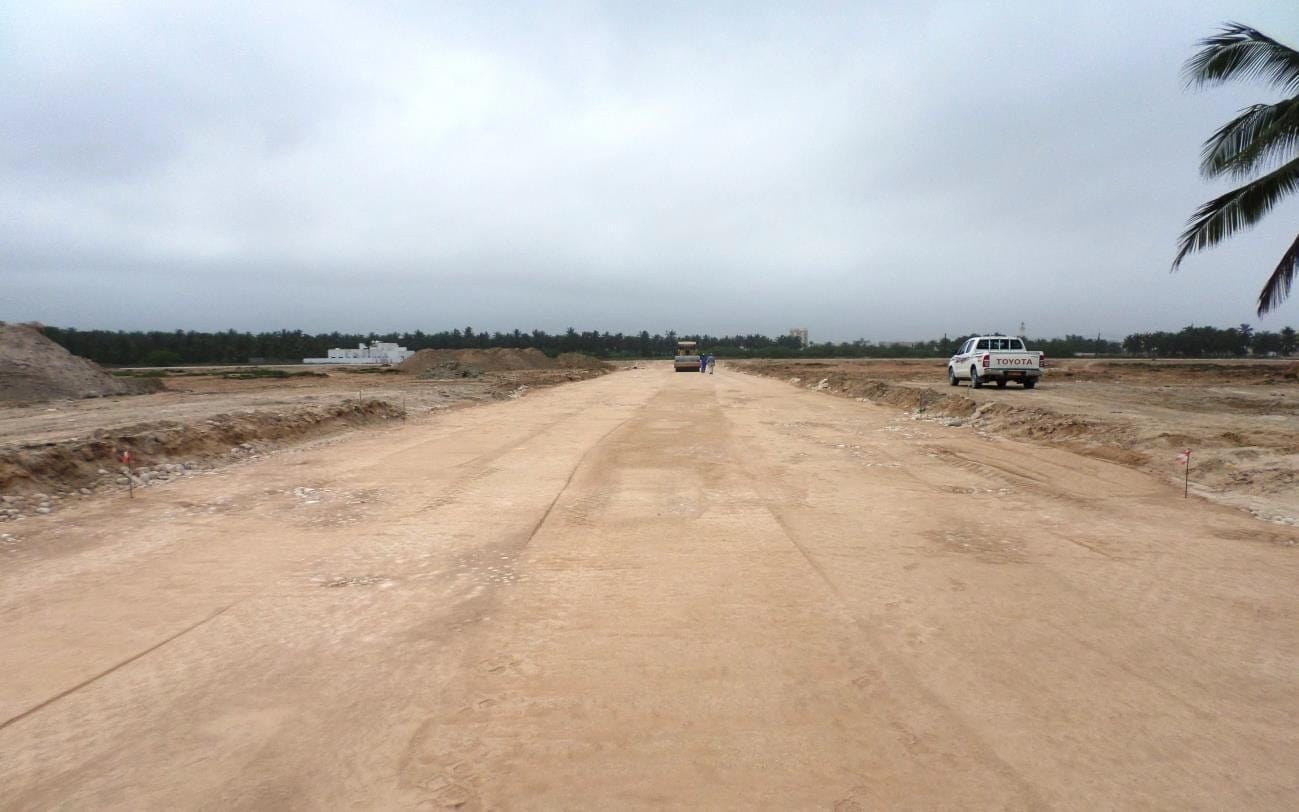 Road widening works with roller and coned lane