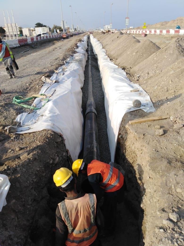 Crew working in a lined trench
